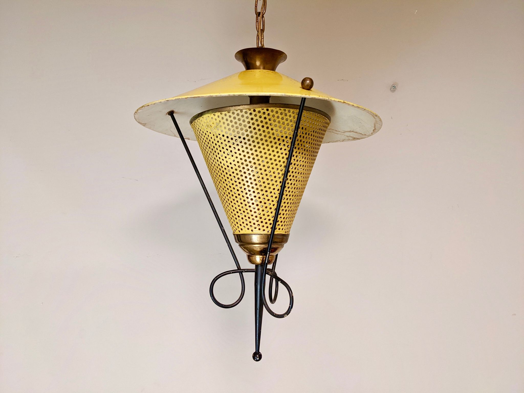 Suspension in perforated sheet metal