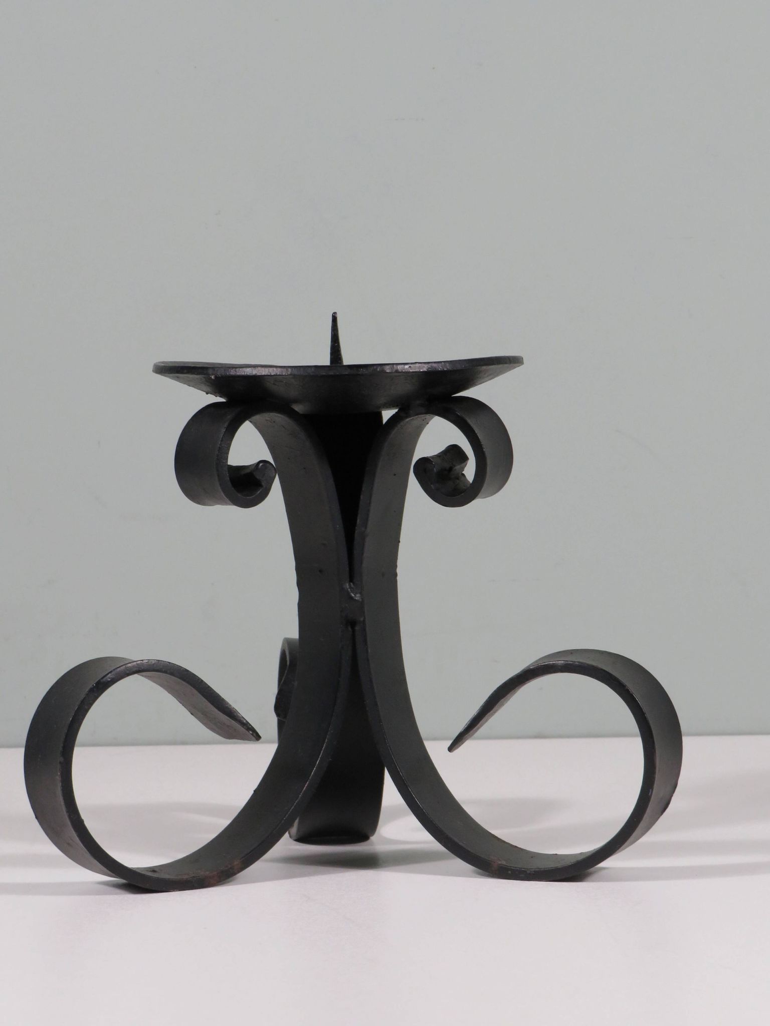 Vintage wrought iron chandelier for large candle.