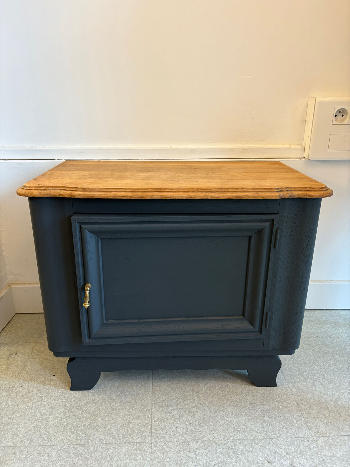 Mat black storage furniture, natural top.