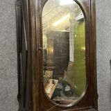Renaissance style oval mirror cabinet in solid walnut circa 1850