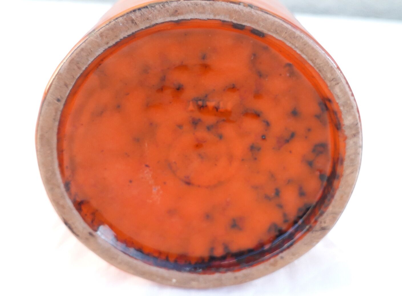 Orange ceramic pitcher