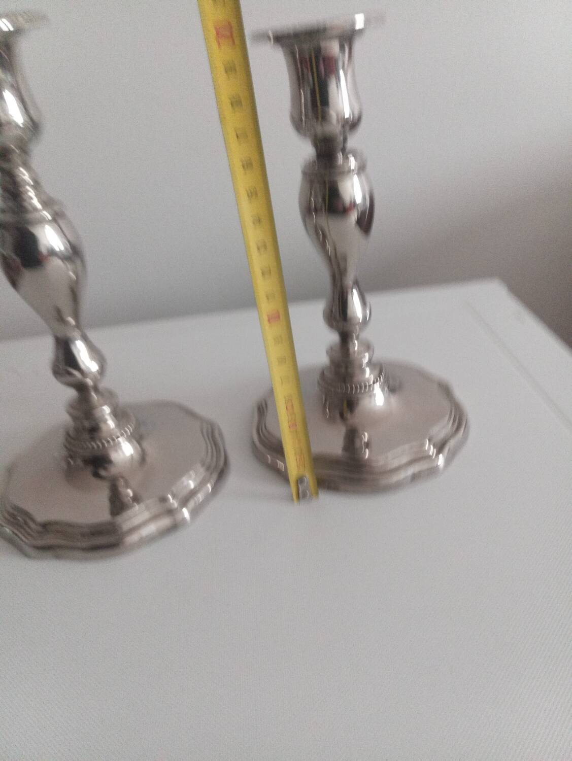 Pair of silver-plated metal candlesticks