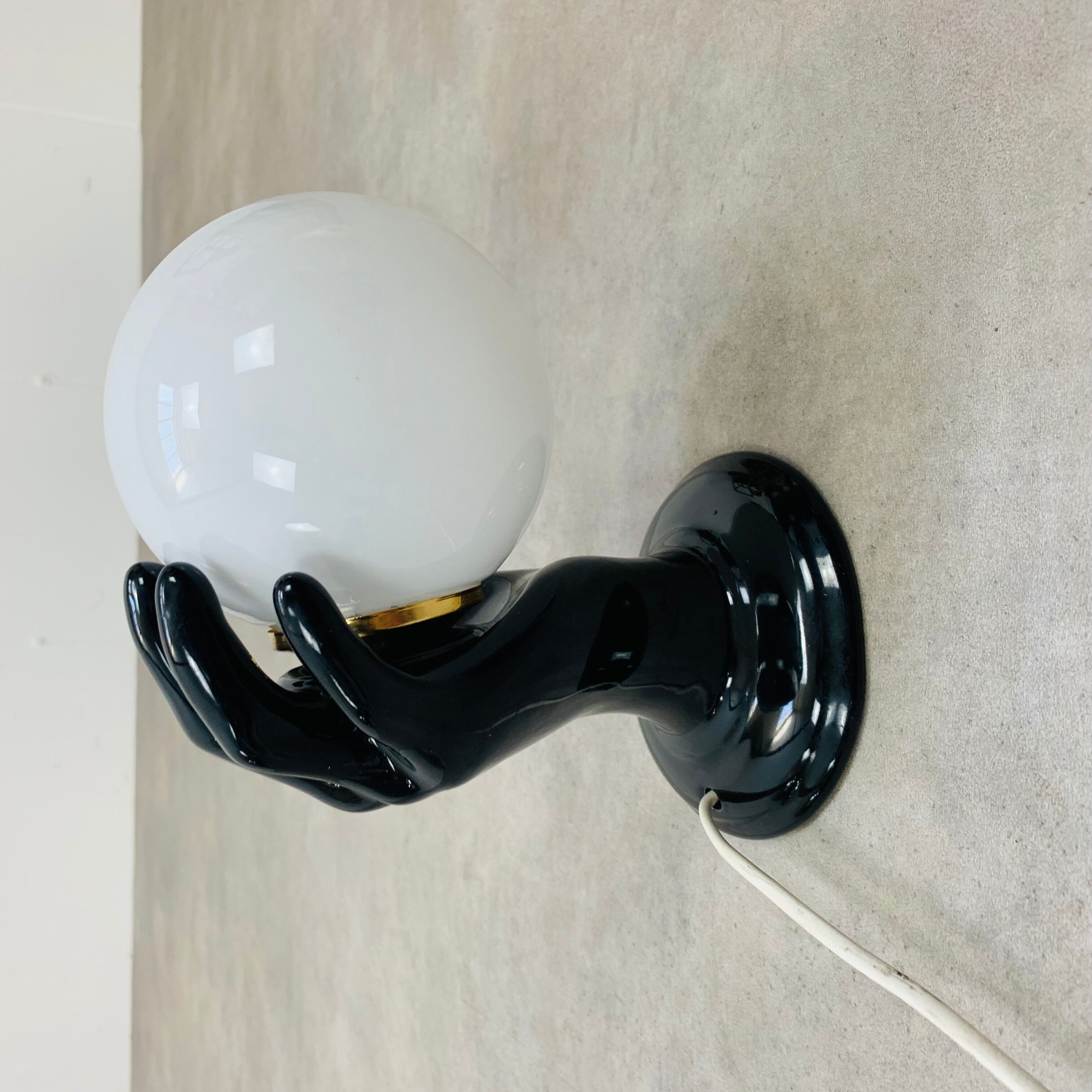 Black and opaline ceramic hand lamp