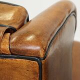 Set of 2 very comfortable large sheepskin armchairs elegantly finished with black piping