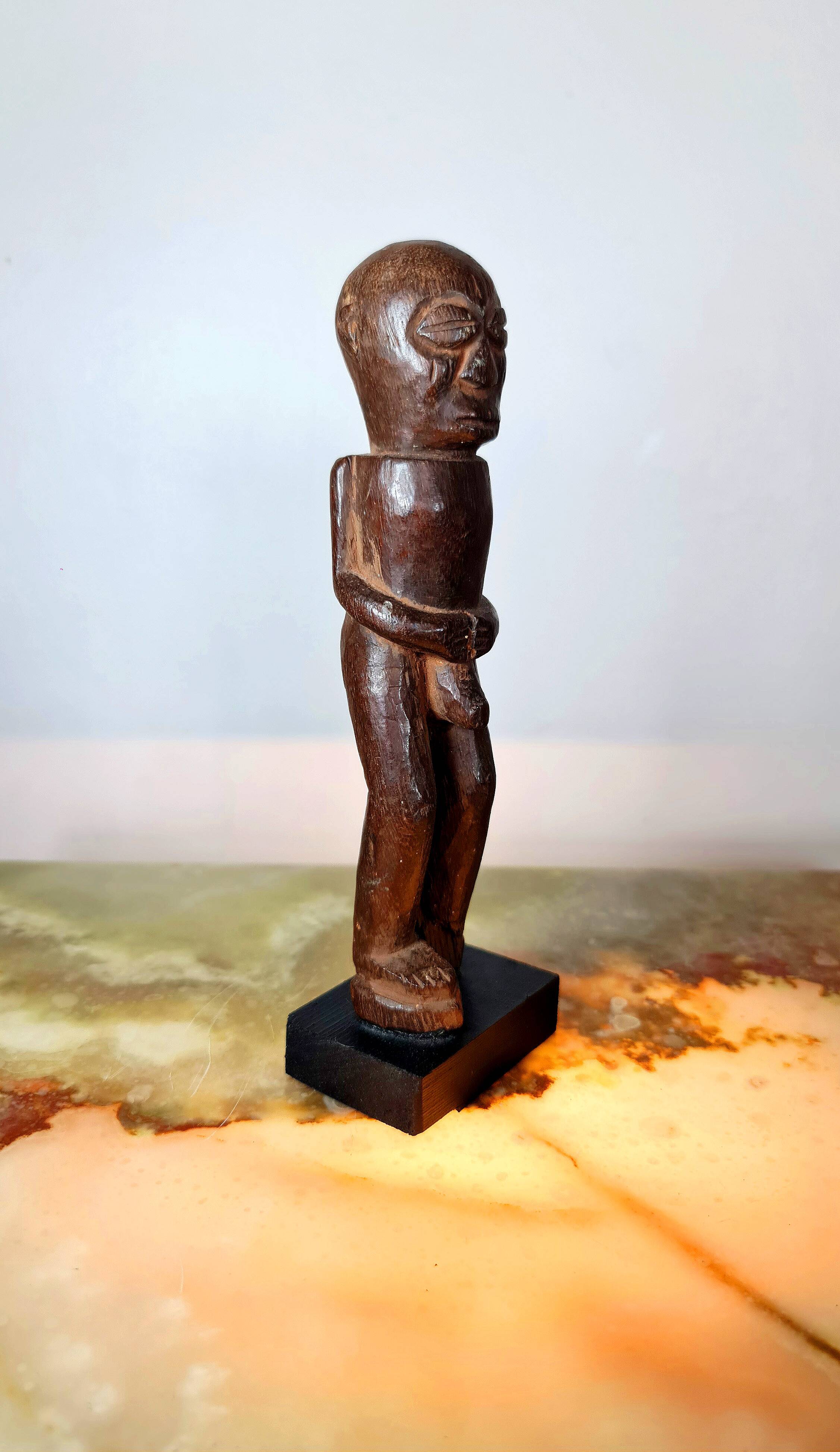 Old Fon statuette on a base, Benin