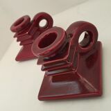 Pair of art deco candlesticks in bordeaux ceramics