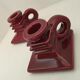 Pair of art deco candlesticks in bordeaux ceramics