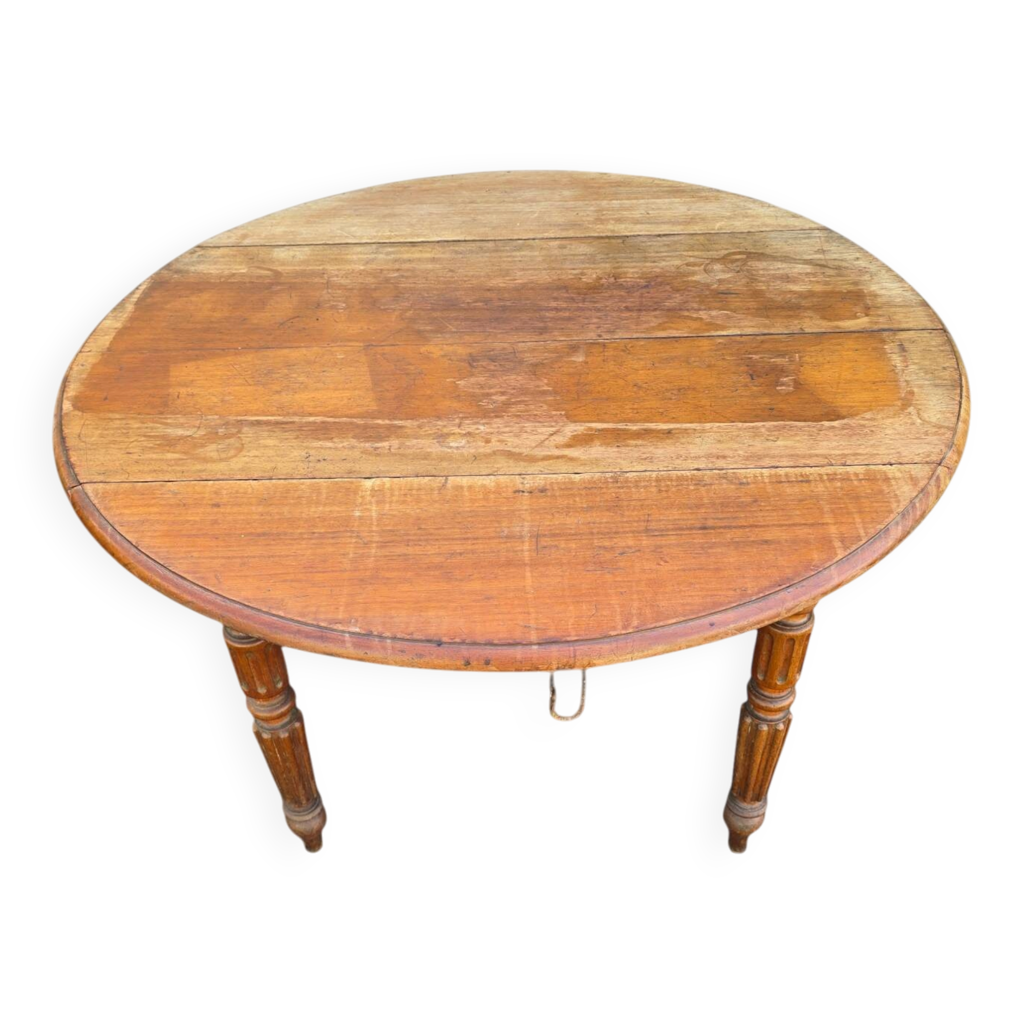 Antique drop-leaf table in wood, with turned legs and castors.