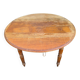 Antique drop-leaf table in wood, with turned legs and castors.