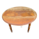 Antique drop-leaf table in wood, with turned legs and castors.