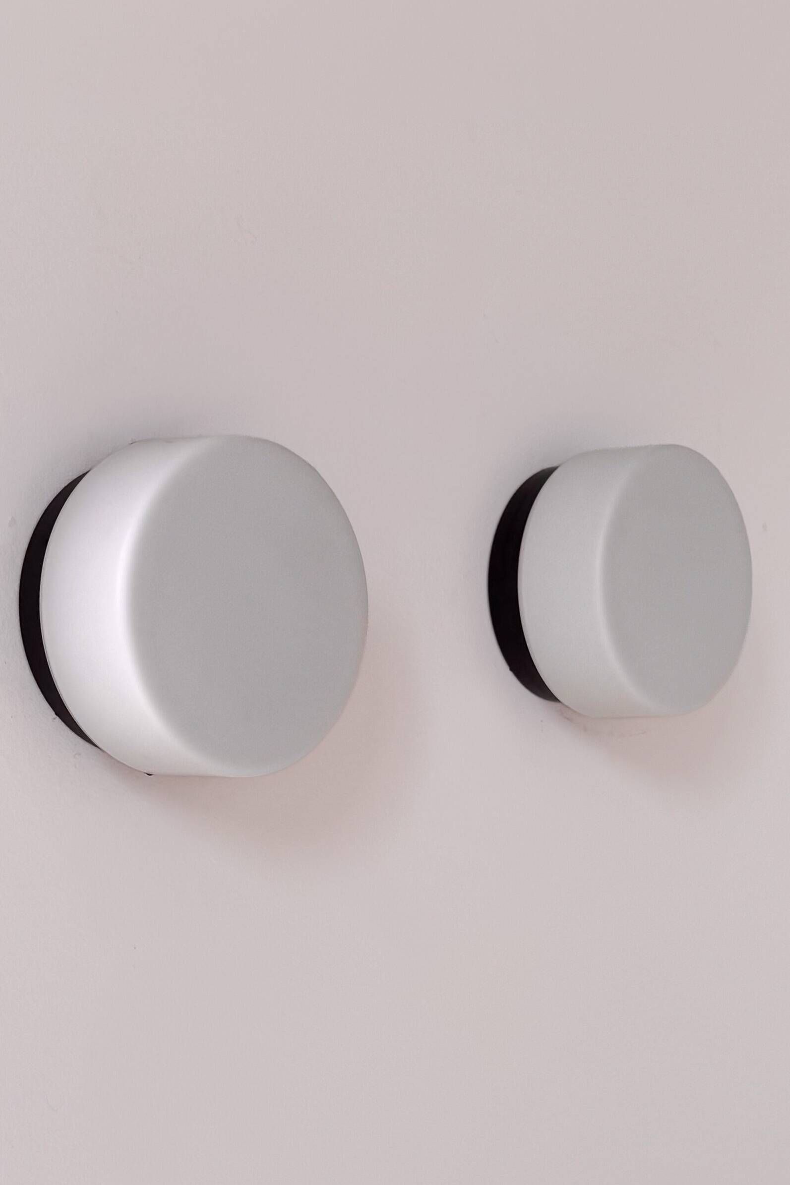 Pair of vintage wall lights in black Bakelite and frosted opal glass, France 1970.