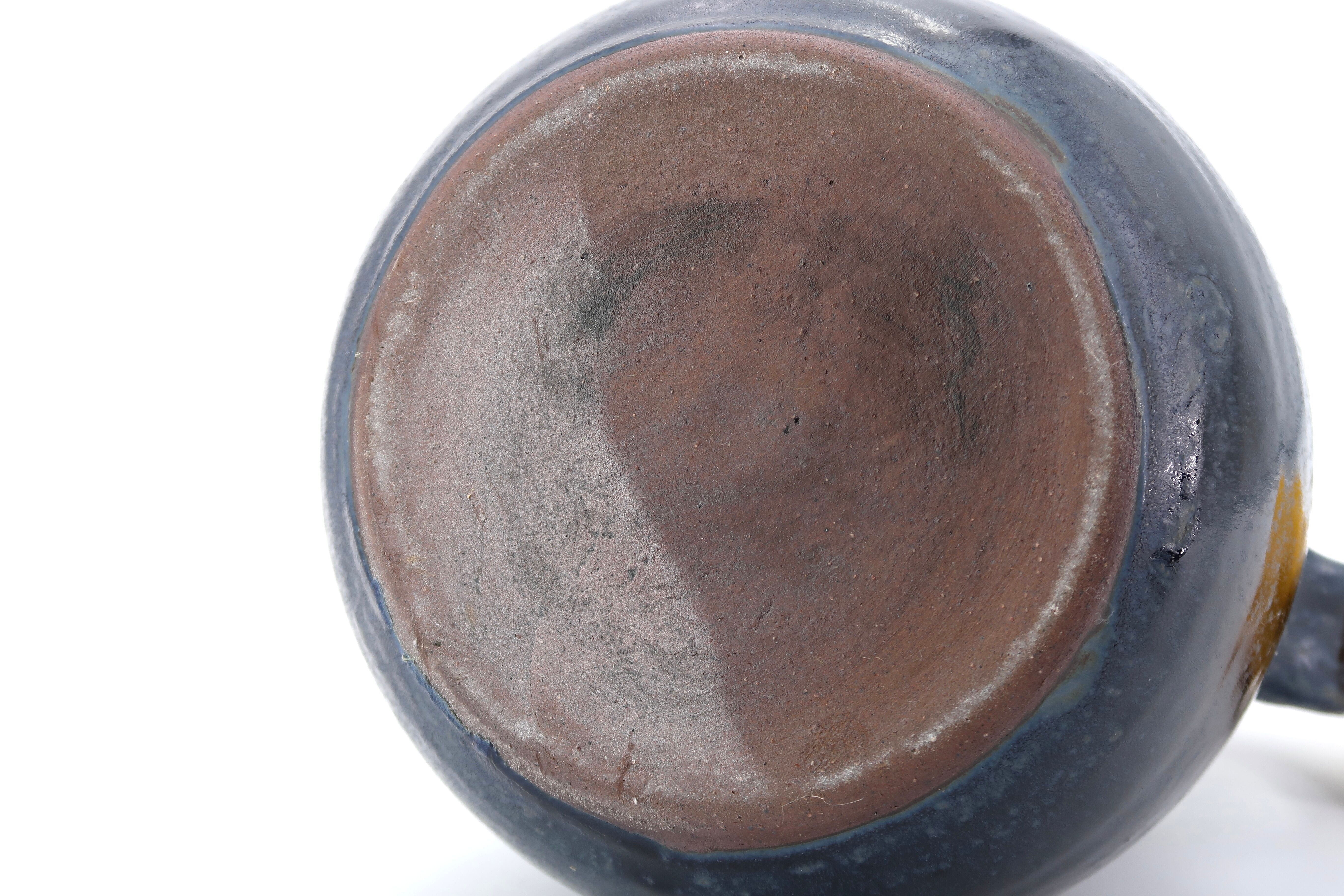 Midnight blue pitcher in sandstone by Jeanne and Norbert Pierlot