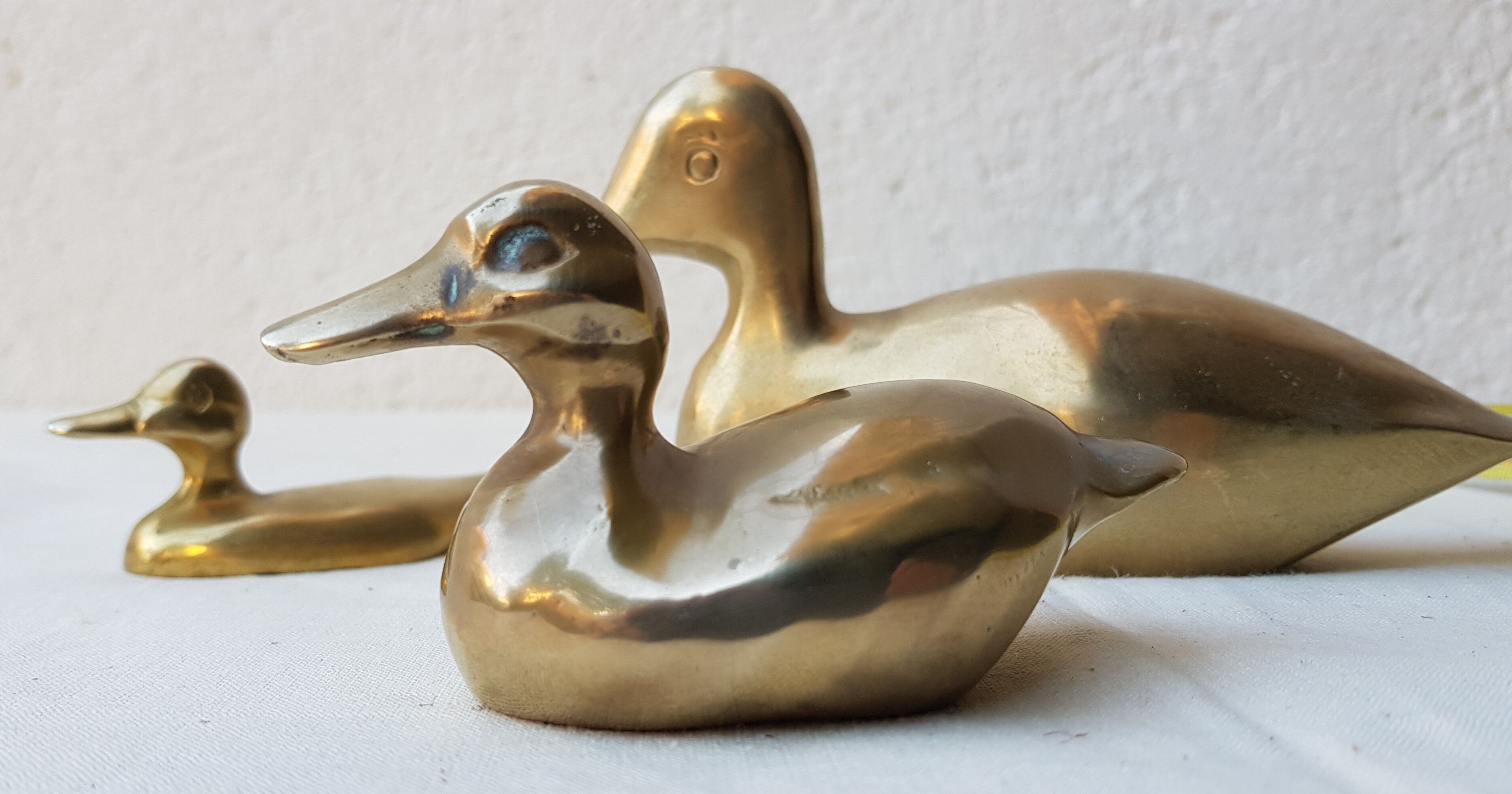 Trio of brass ducks
