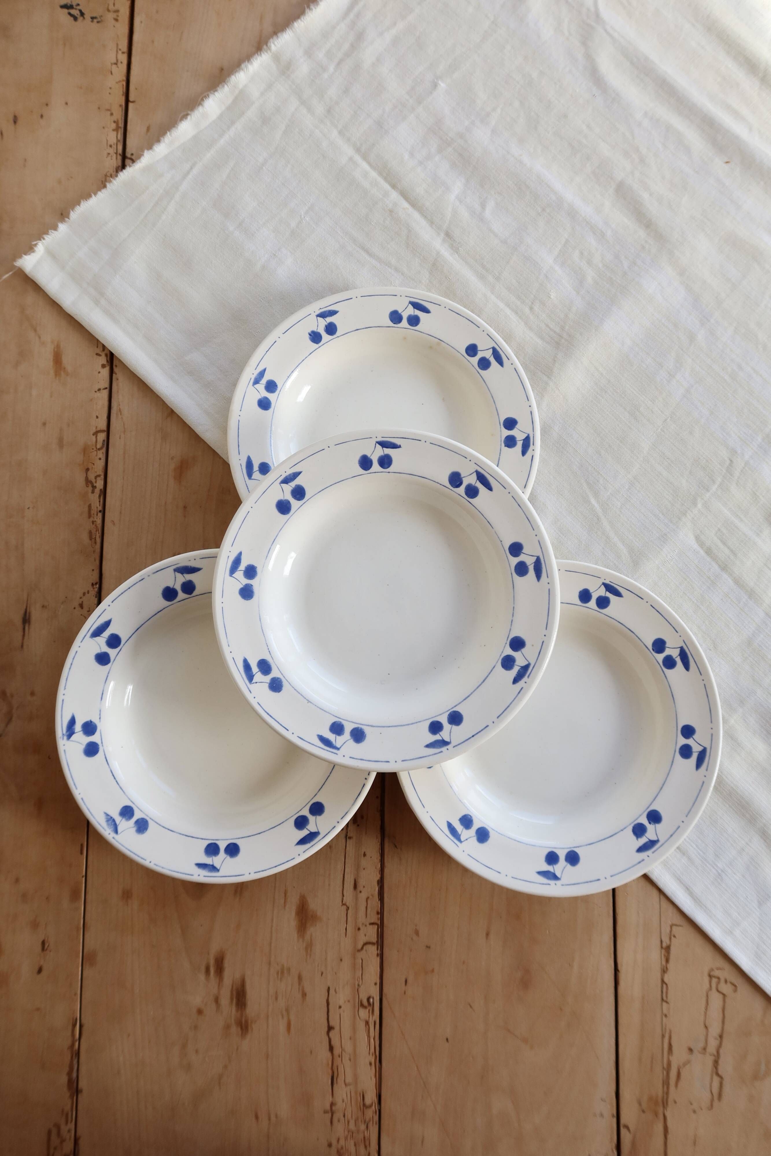 4 vintage deep plates in ivory earthenware with blue cherries