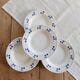4 vintage deep plates in ivory earthenware with blue cherries