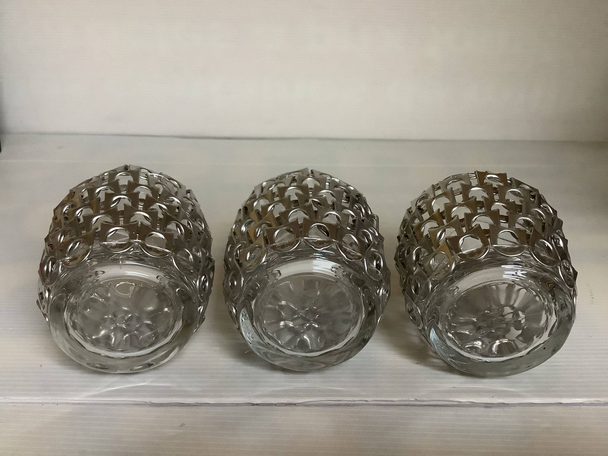 Trio of candle holders in metal strips folk art