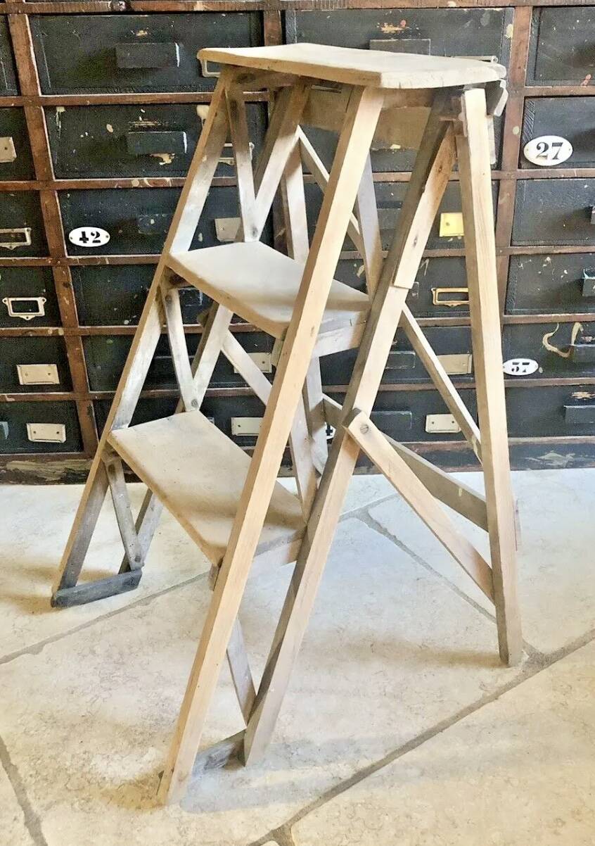 Old small painter's stepladder, wooden trade furniture, step stool