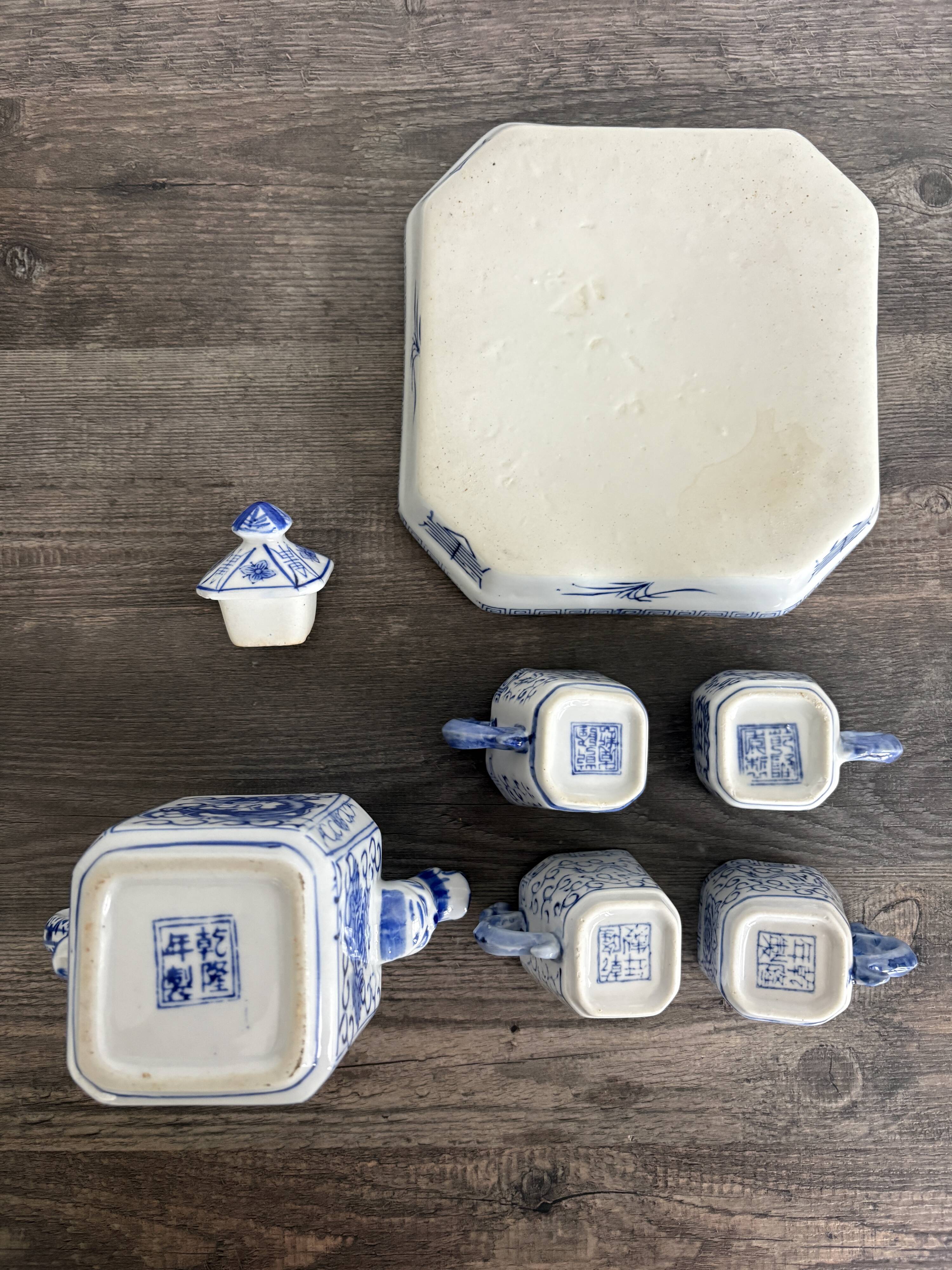 Antique Chinese tea set decorated with dragons.