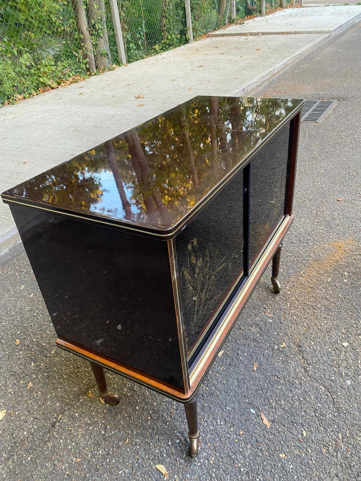 Illuminated bar cabinet Hollywood Regency black and gold 1970