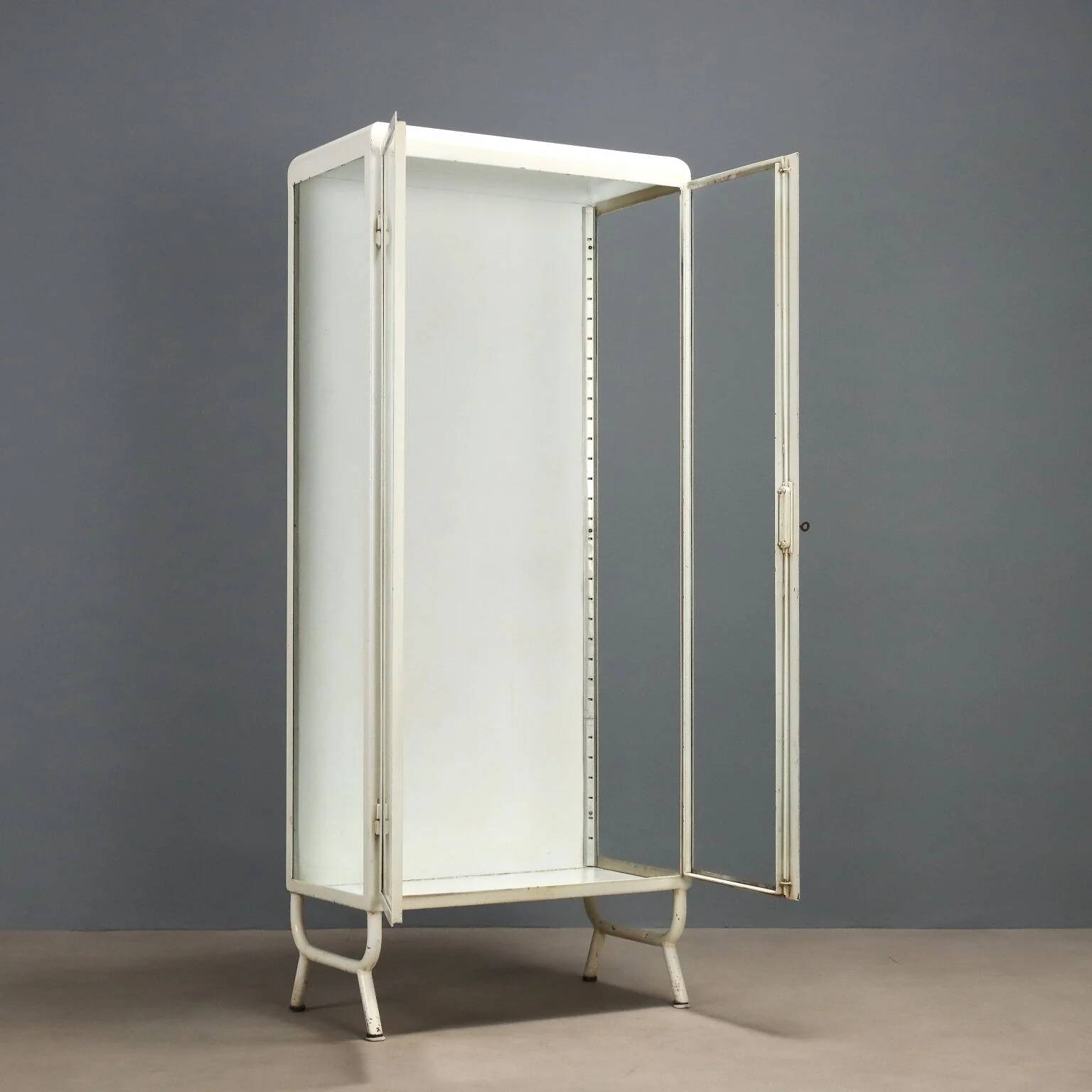 Antique enamelled iron and glass display cabinet, Italy, 20th century