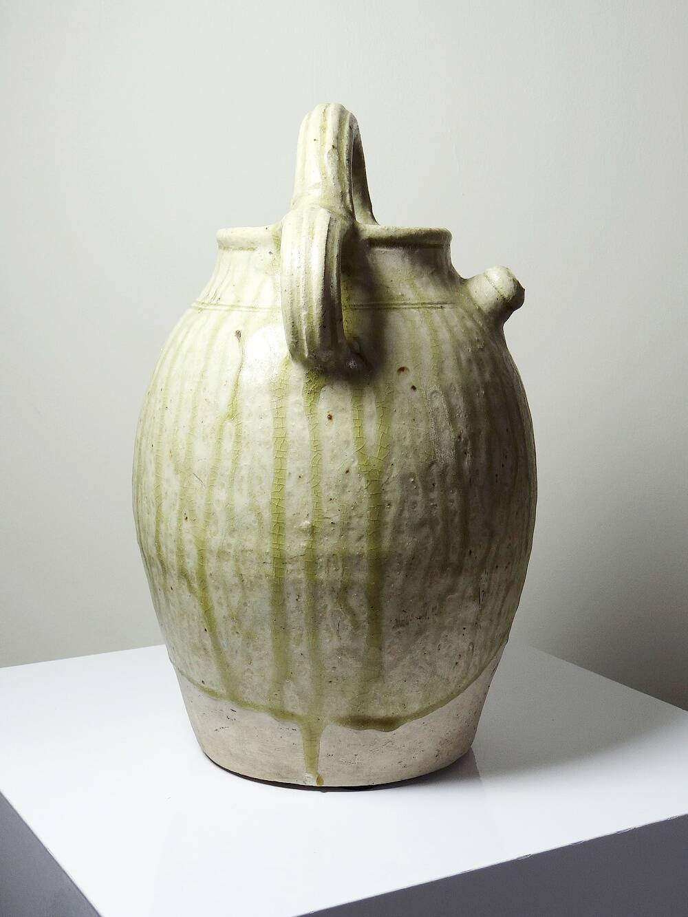 Green ash-glazed stoneware casserole from Puisaye, late 19th to early 20th century.