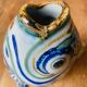 Blue ceramic zoomorphic vase in the shape of a poison.