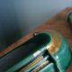 Poët Laval knife rest in emerald green ceramic and gold.