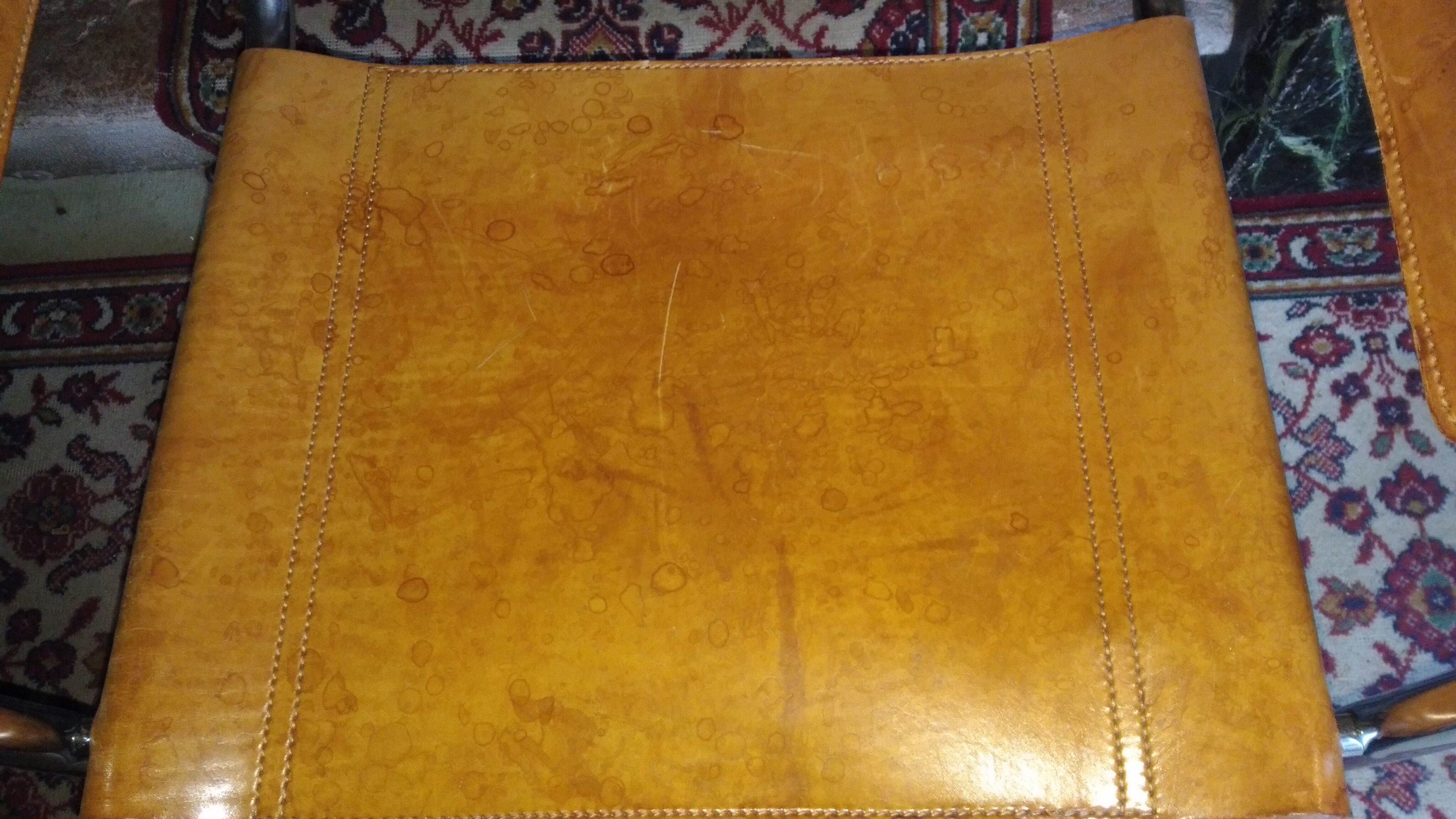 Three  leather armchairs