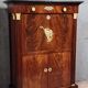 Rare four-column secretary from the Empire period in flame mahogany and bronze.