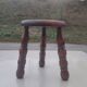 Small vintage tripod stool made of turned wood, in the style of Charles.