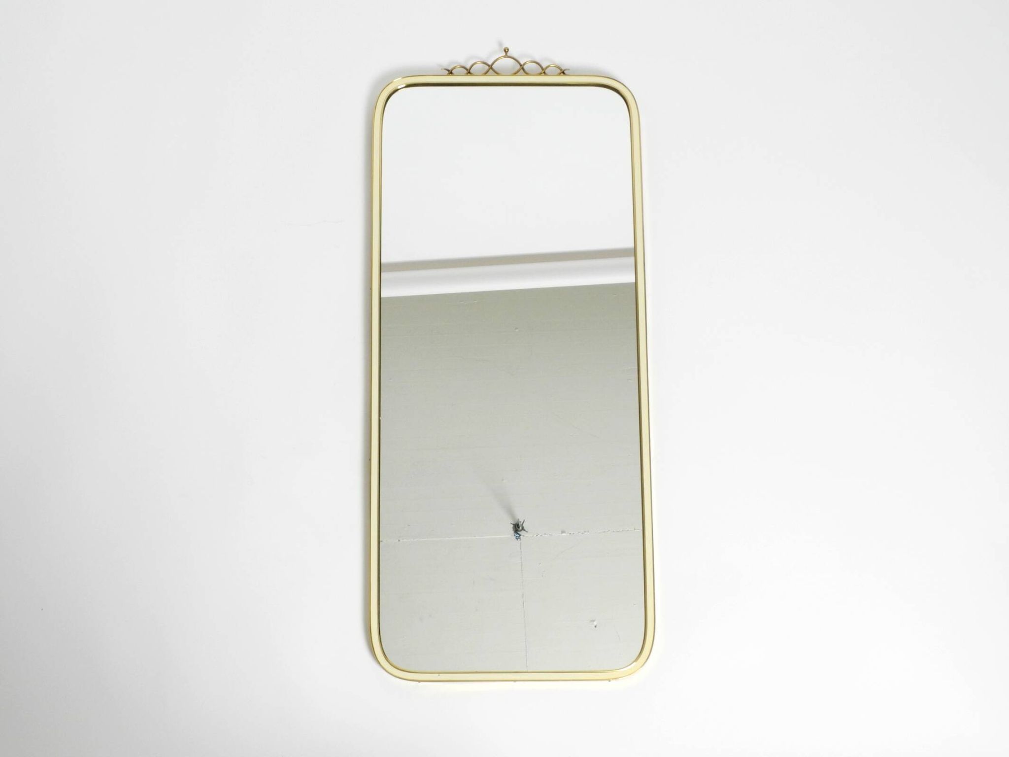 Large heavy long Mid Century brass wall mirror by Münchner Zierspiegel
