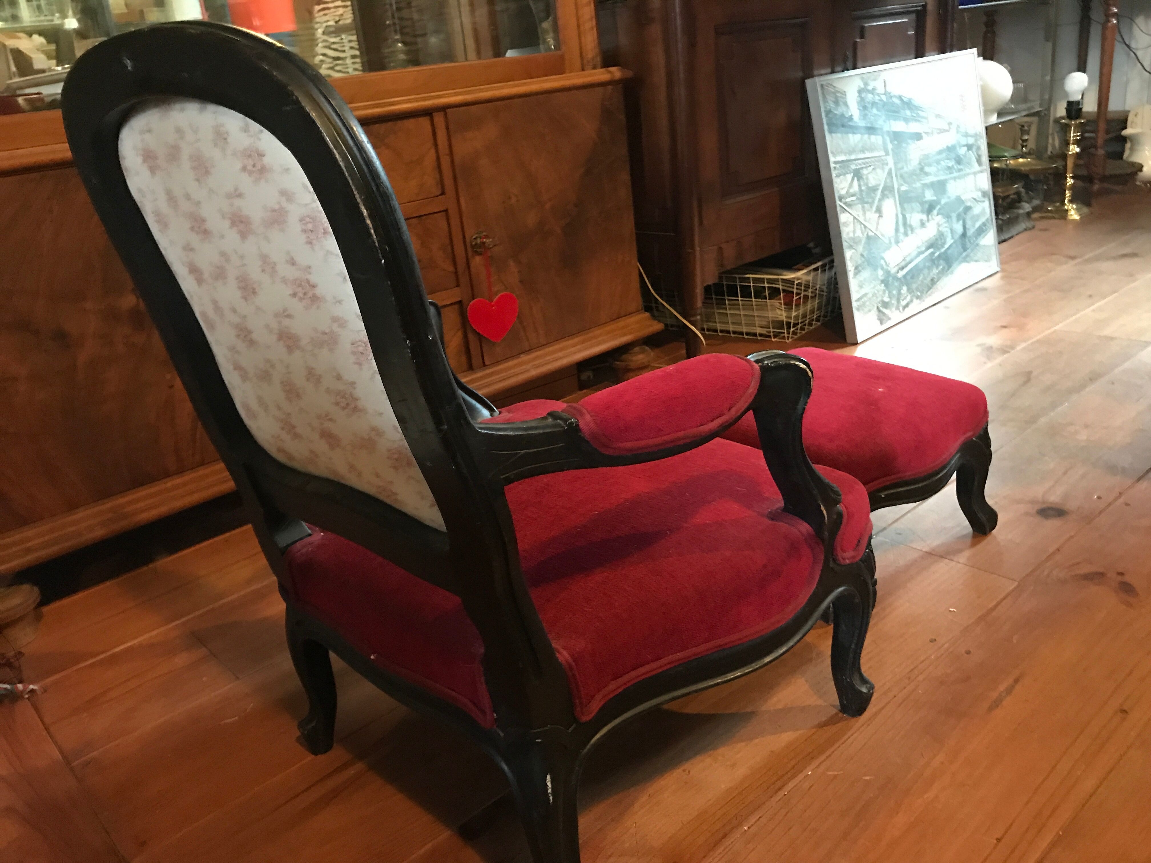 Old children's armchair with foot rests