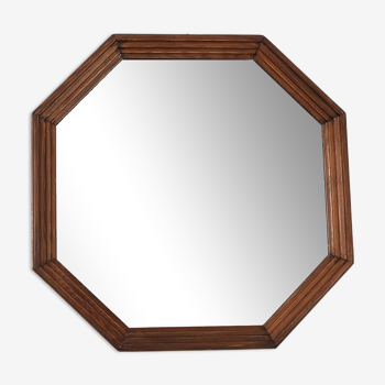 Old second-hand wooden mirror, octagonal shape.
