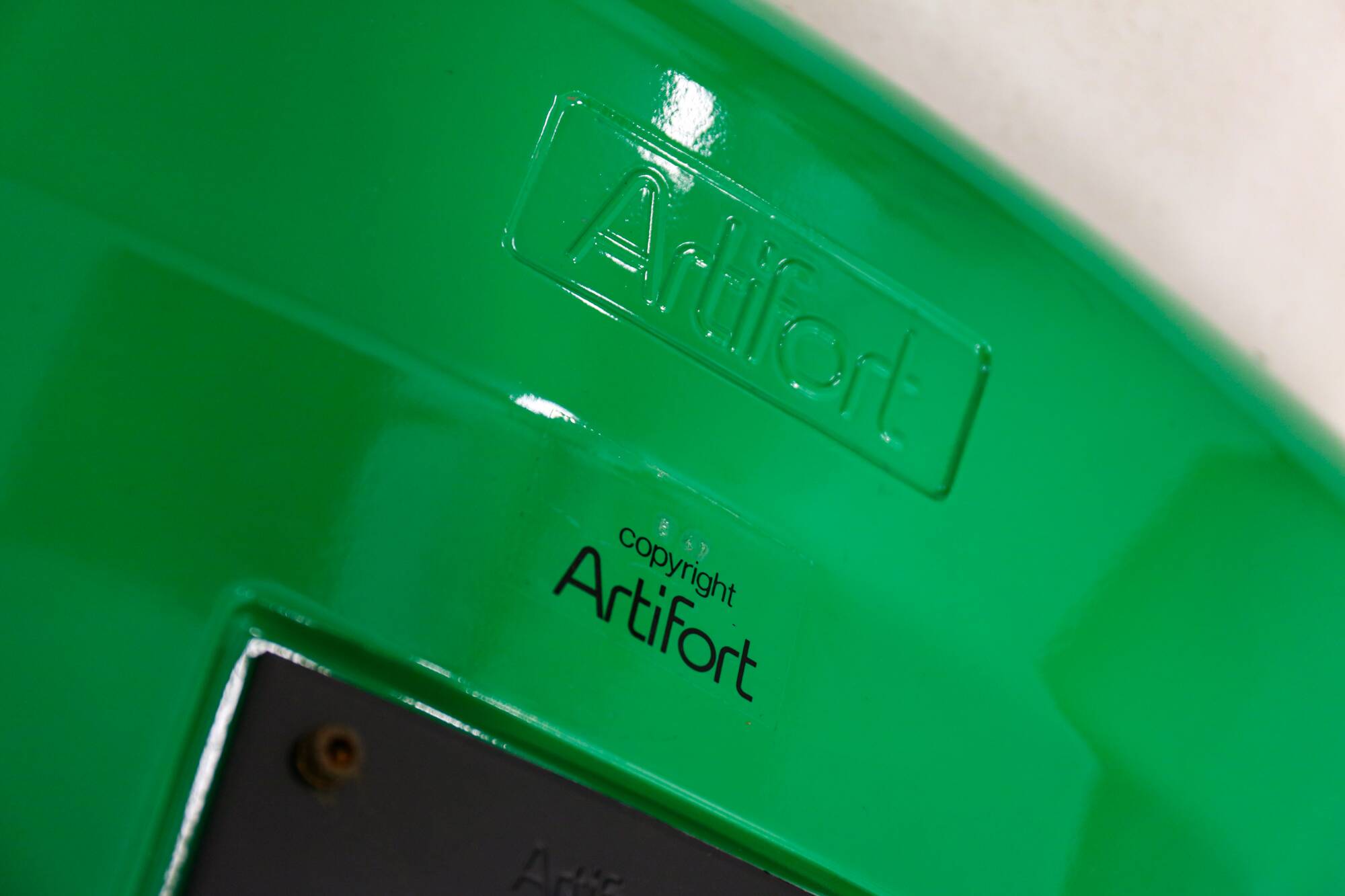 Green Artifort armchair, design by Geoffrey Harcourt.