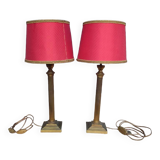 Pair of empire style lamps with red lampshades