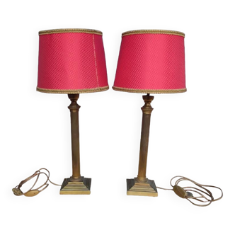 Pair of empire style lamps with red lampshades