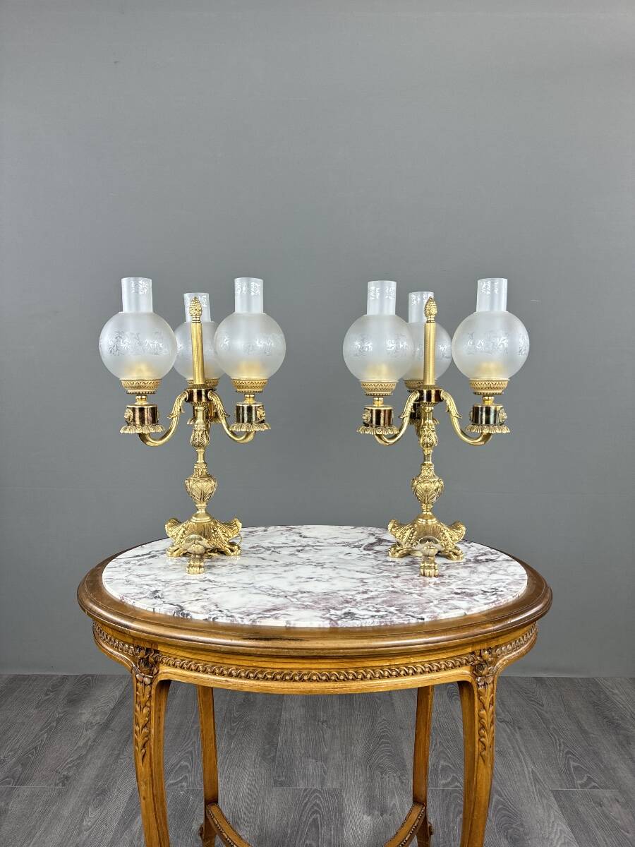 Pair of three-light candelabra in bronze, 20th century