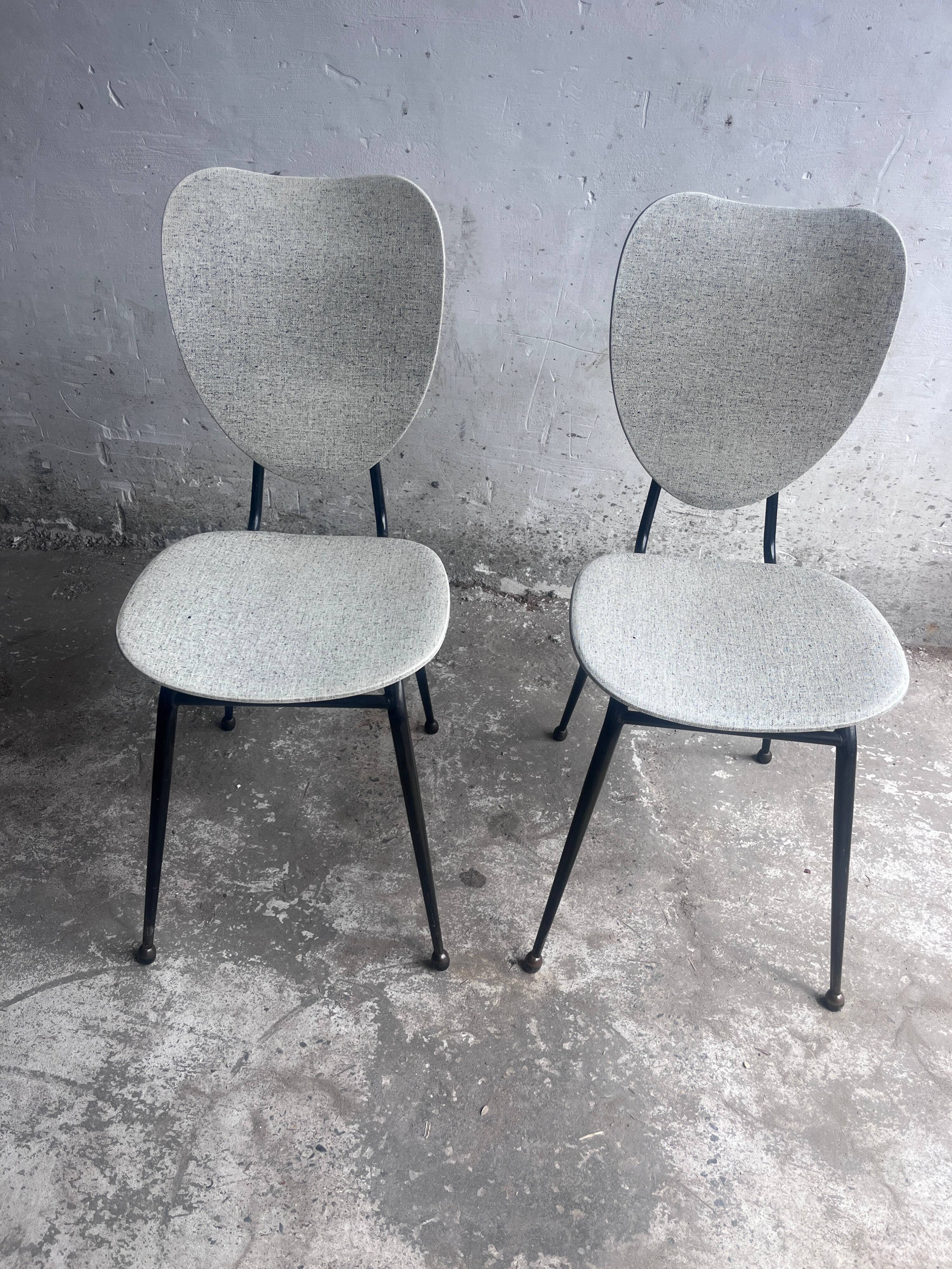 Elegant pair of French dining chairs by Jacques Hitier from the 1950s.