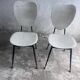 Elegant pair of French dining chairs by Jacques Hitier from the 1950s.