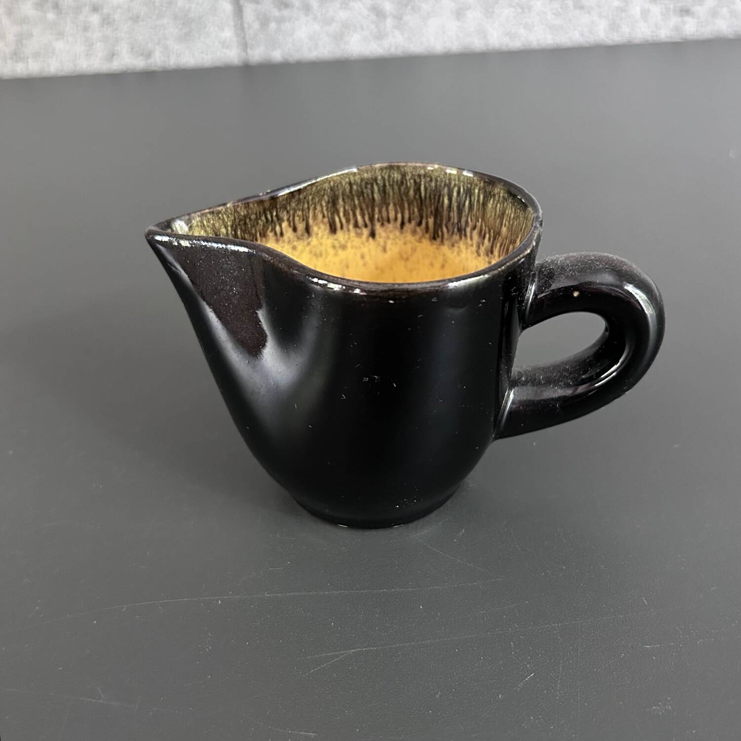 Keraluc black and yellow creamer