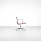 "EA 108" armchair in red leather, designed by Charles and Ray Eames for Vitra,