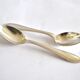 Set of 2 silver-plated teaspoons with a gold filigree design, 13.5 cm.