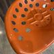 Orange tractor stool, pivoting adjustable mower, Fermigier Mirima 70.