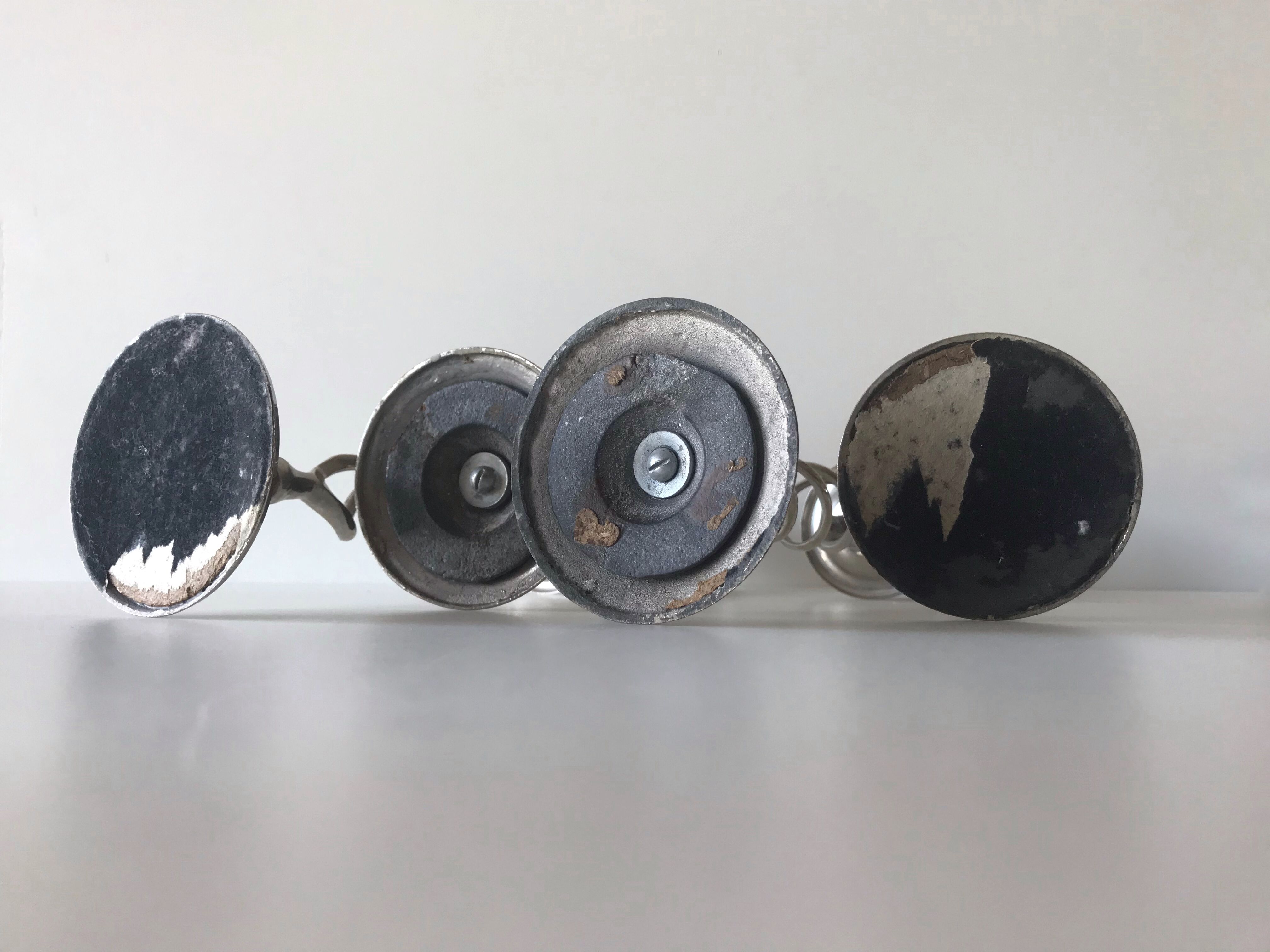 Four twisted silver candlesticks