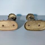 Pair of bronze hand candlesticks decorated with chimeras 19th century