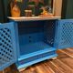 Large colonial style wooden cabinet with latticework