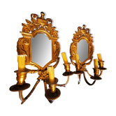 Pair of chissed and gilded bronze mirrors forming appliques