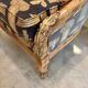 Armchair in a wooden confessional style with black and beige cotton.