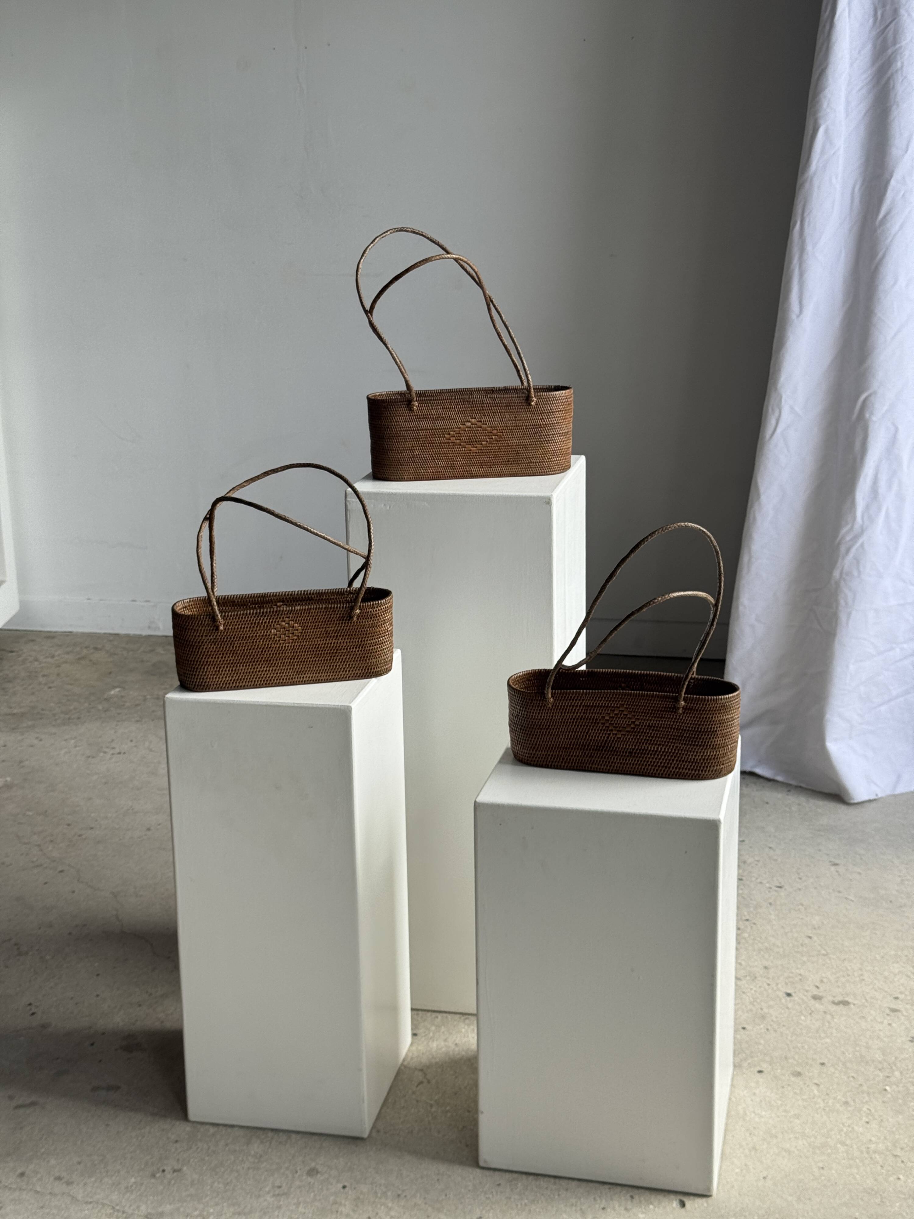 Small oval basket with long handles, traditional Indonesian L28xH10