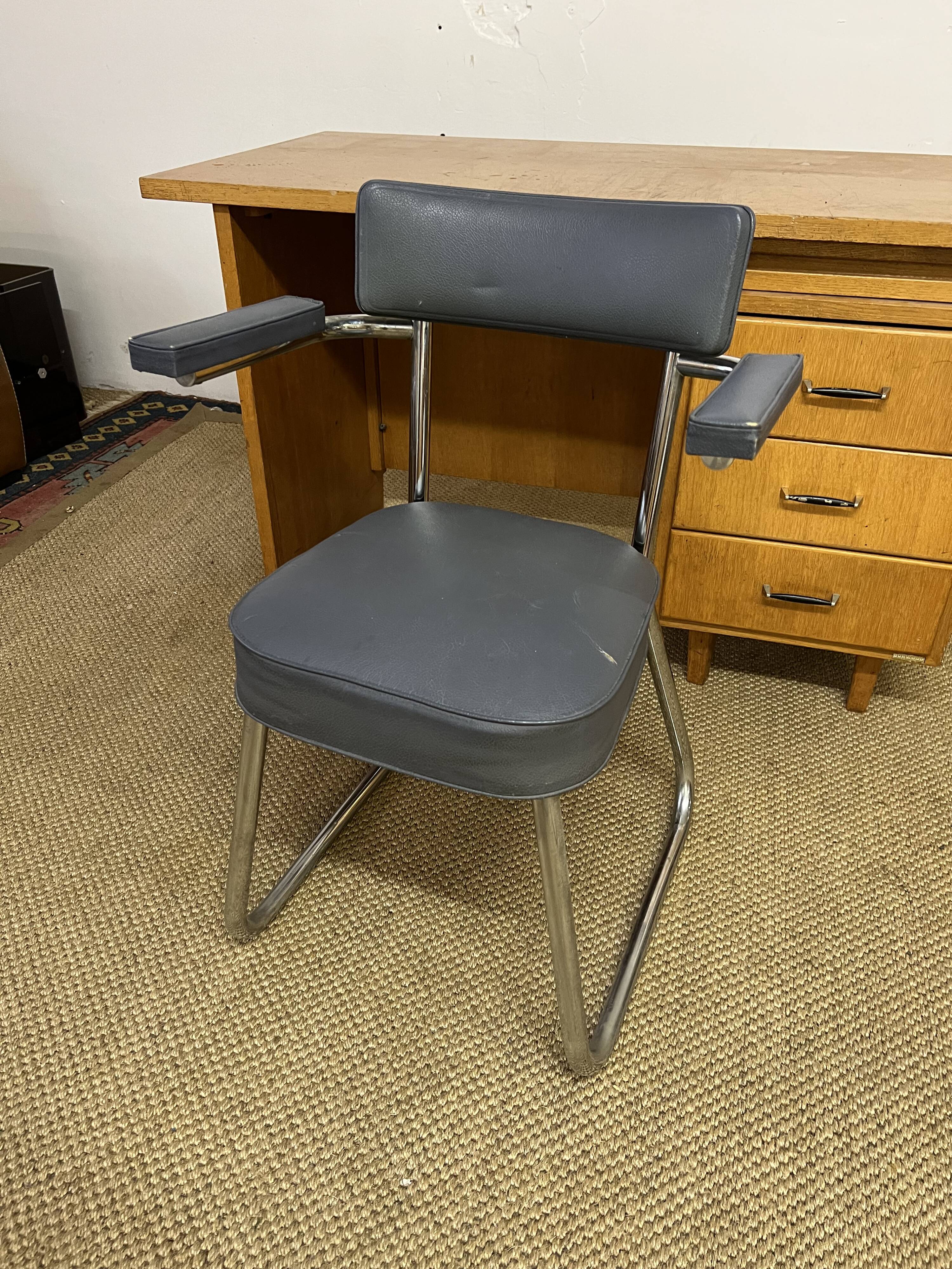 Old wooden desk and armchair